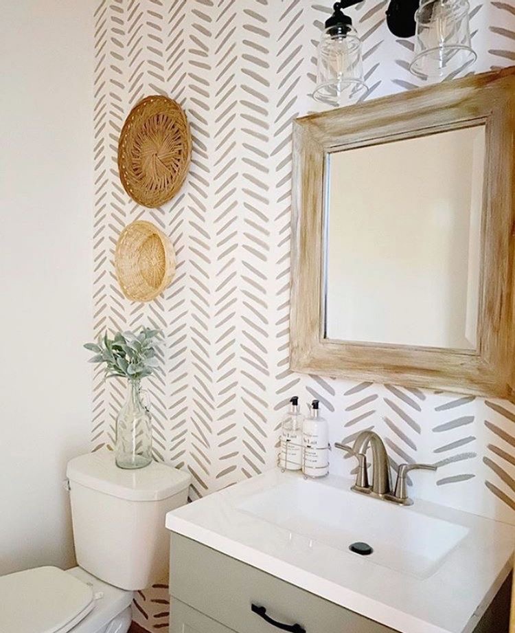 Powder room with hand-painted sprig pattern accent wall — a DIY wallpaper alternative accent wall idea using paint.