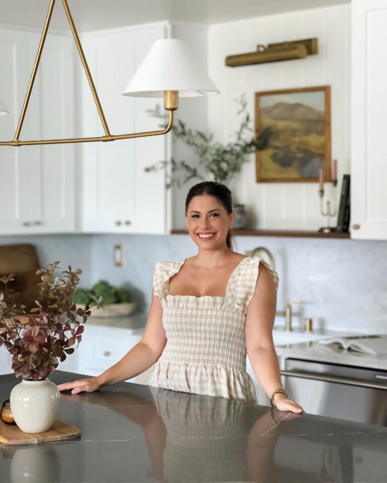Liz Lovery standing at the kitchen island in her Paisley Project renovation