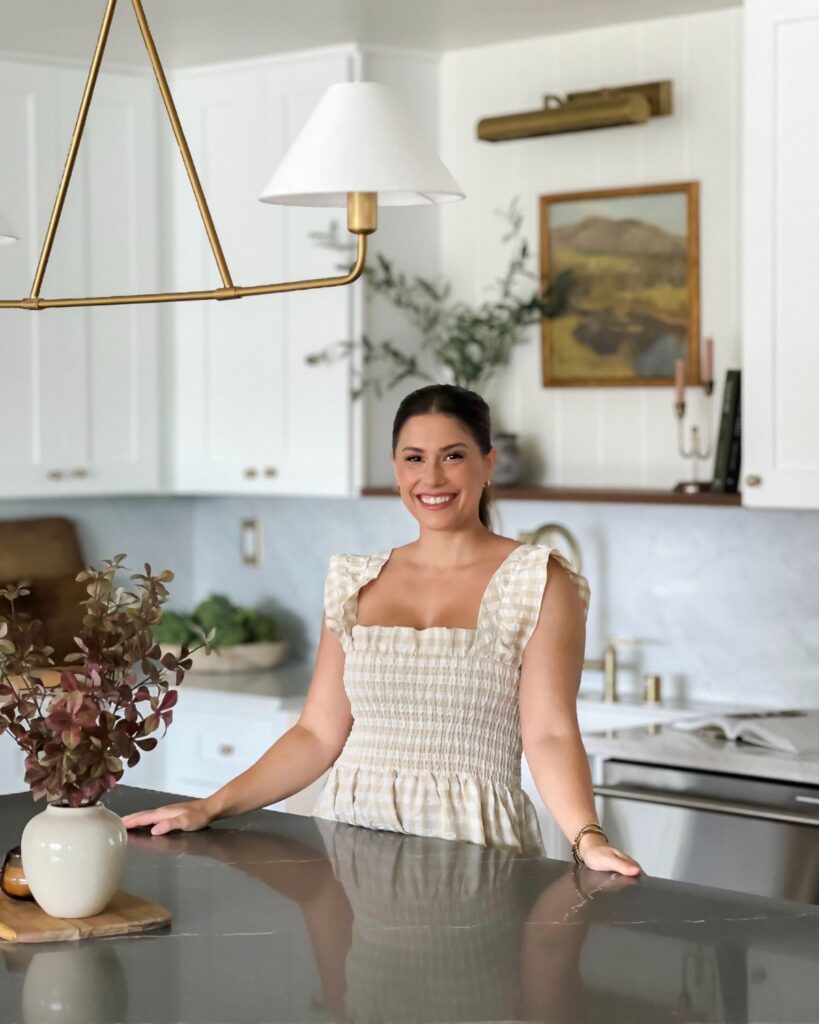 Liz Lovery standing at the kitchen island in her Paisley Project renovation