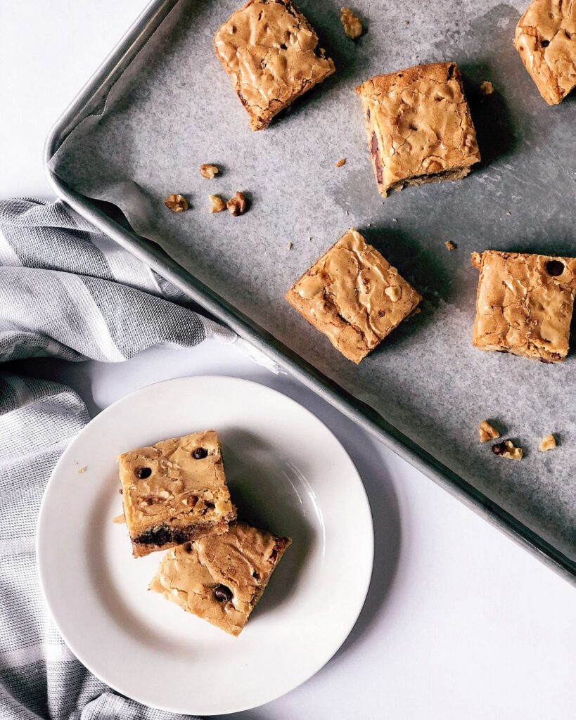 Homemade chocolate chip blondies with crisp golden tops, rich buttery flavor, and soft chewy interiors.