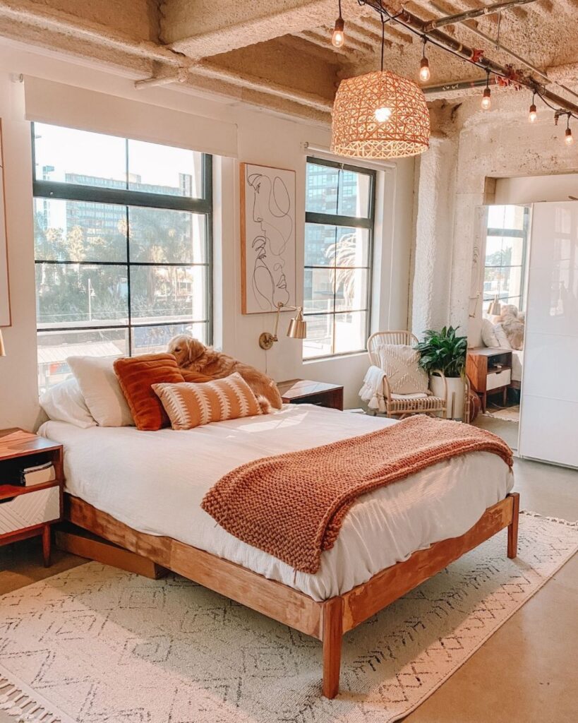 Styled loft bedroom with a DIY woven basket pendant light hanging from the ceiling