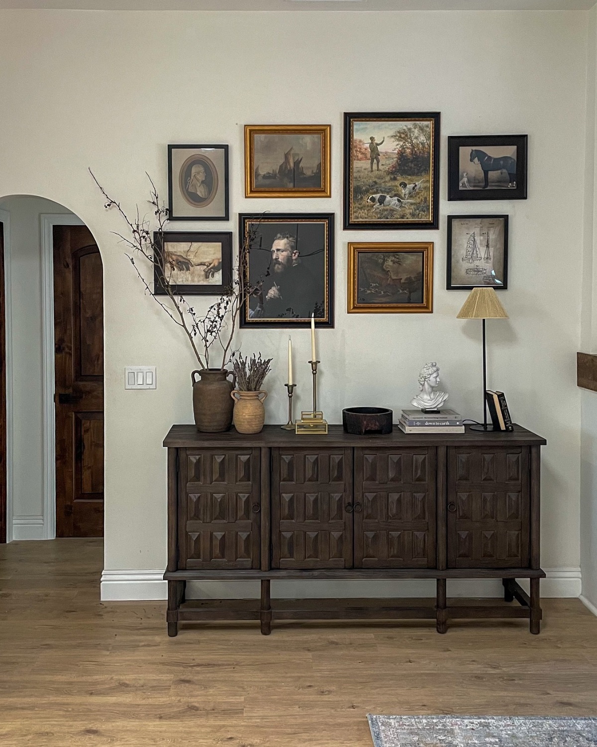 artwork display with 8 piece gallery wall art and brown sideboard table