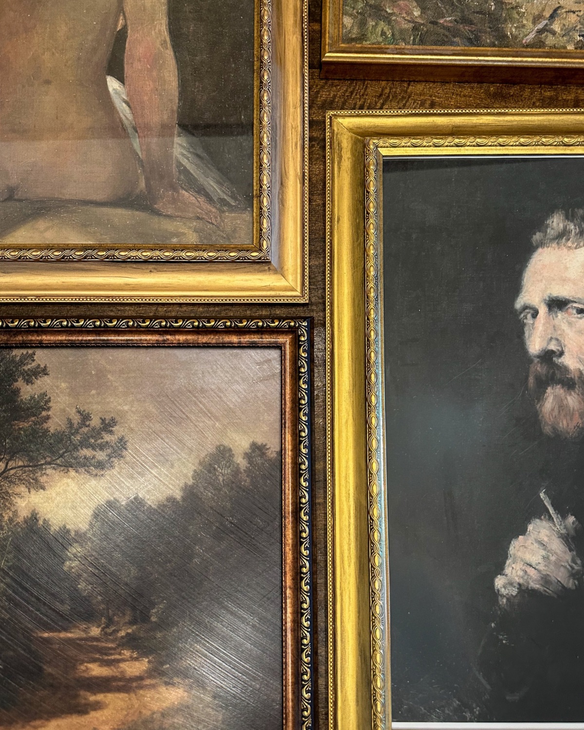 close up of gallery wall spacing when using different sized frames