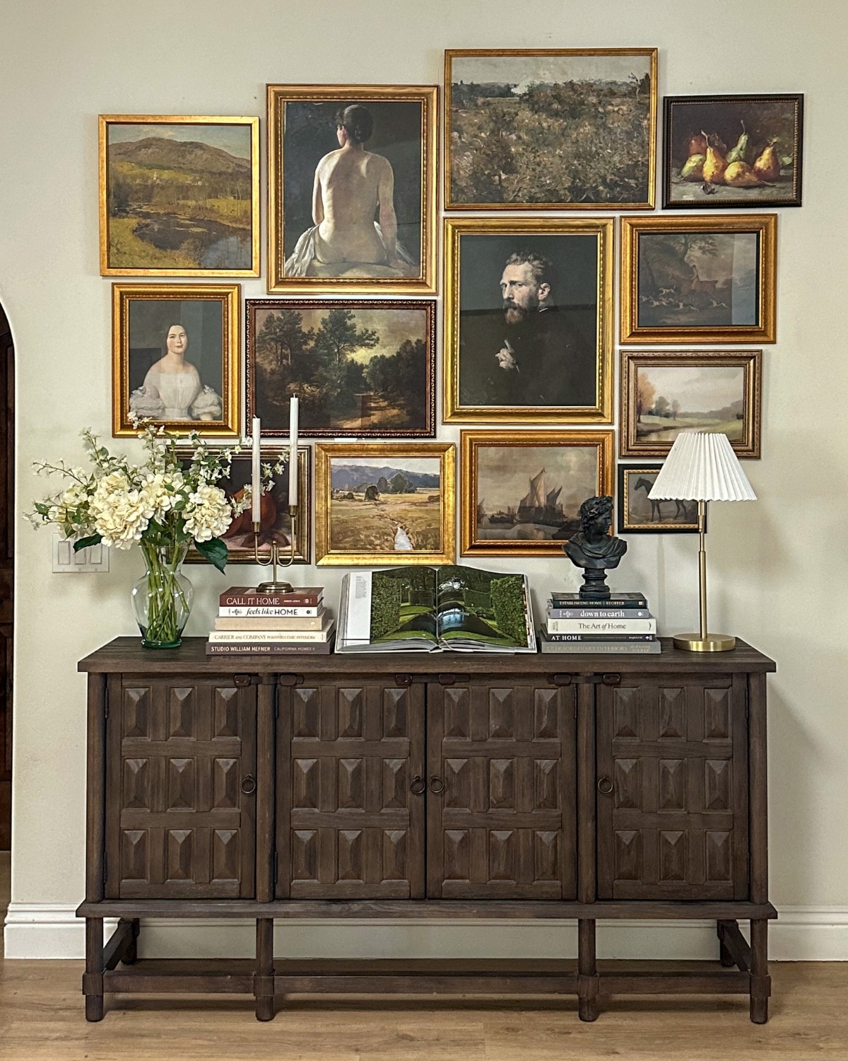 traditional gallery wall with rustic credenza
